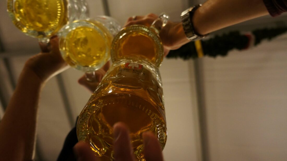 Maßkrug Liter Beer Cheers at Oktoberfest in Munich